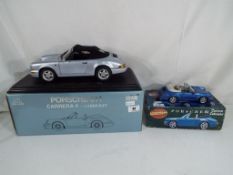 Diecast - two diecast models of Porsche motor vehicles to include a 1:14 scale model by Anson of a