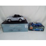 Diecast - two diecast models of Porsche motor vehicles to include a 1:14 scale model by Anson of a