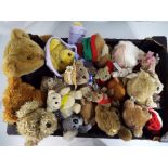 Teddy bears - a box containing a quantity of teddy bears and cuddly toys.