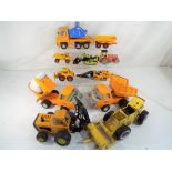 A good lot to include seven Tonka and similar vehicles in playworn condition.