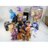 A good lot comprising a quantity of Ty Beany Babies and a Merry Thought Bear in original box