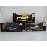 Diecast - three 1:18 scale models of Porsche motorcars comprising a Maisto Porsche Boxster,