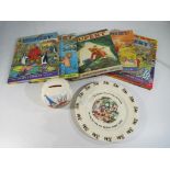 A good lot to include six vintage Rupert the Bear annuals and a Noddy plate and ceramic money box.