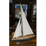 Model sailing yacht on stand