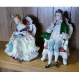 Pair of Continental regency style seated figure ornaments