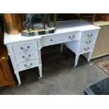 5' white painted Edwardian kneehole desk or dressing table with fitted 7 drawers standing on reeded