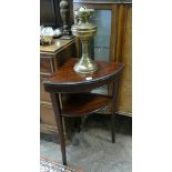 Small two tier mahogany corner table and a brass oil lamp