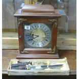 Reproduction bracket clock in mahogany case and a set of bone handled carvers