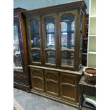 A 4'3 walnut glazed display cabinet with cupboards under