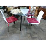 4' circular glass topped dining table and 3 white chairs with seat cushions