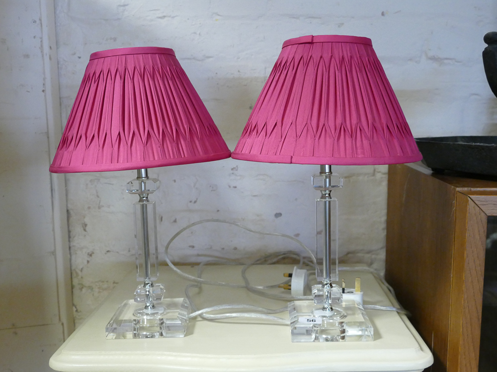 Pair of modern glass bedside lamps with fitted pink shades