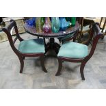 Circular reproduction mahogany single pillar dining table and four sabre leg chairs with green