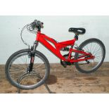 Boys Apollo red mountain bike with front suspension and 18 speed gears