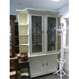 A 6' shabby chic distressed cream painted part glazed display cabinet with iron grilled doors and