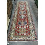 A 3mtr Persian red and patterned carpet runner Condition - no damage.