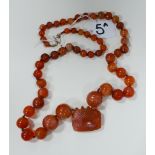 Banded agate graduated bead necklace with square pendant drop and gold clasp