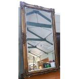 Gilt framed mirror and a hanging galleon gong stand