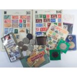 Album containing British Commonwealth and world stamps, together with a few coins,