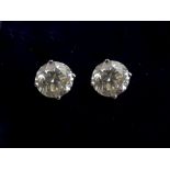 Pair of single stone diamond stud earrings, each weighing approx 0.