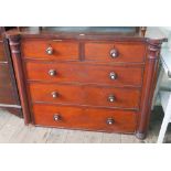 Victorian mahogany chest of drawers with 3 long and 2 short drawers with bun handles and column