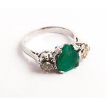 Large emerald and diamond 3 stone ladies ring set with a pear shaped emerald,