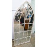 Tall arched indoor/outdoor mirror in a Gothic style