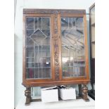 Oak bookcase with leaded glass doors