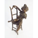 Contemporary green patinated bronze of young girl on chair teasing a cat - height 23cm tall