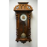 Victorian Vienna style striking wall clock in walnut and glazed case