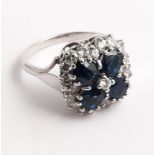 Large sapphire and diamond cluster ring set with four oval sapphires in a quatrefoil motif