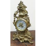 French striking mantel clock in decorative gilt and rococo style case,