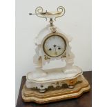 French striking mantel clock in decorative white alabaster case on gilt wood stand