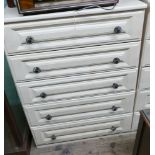 Five drawer light wood chest of drawers with metal handles