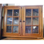 Wall hanging pine cabinet with glass doors