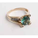 Green tourmaline and diamond dress ring on 14ct yellow gold shank.