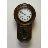 Small drop dial wall clock in oak case with striking movement