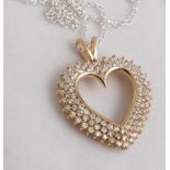 Large and impressive yellow gold heart shaped diamond pendant necklace,