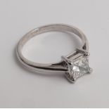 18ct gold princess cut diamond engagement ring. The princess cut diamond weighing 0.