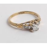 Art deco 18ct gold solitaire diamond ring with small diamonds to the mount.