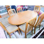 Teak extending dining table with 6 matching chairs