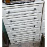 Five drawer light wood chest of drawers with metal handles