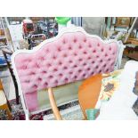 Cream painted French bed surround with pink buttoned back panels,