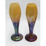 Pair of iridescent glass tulip vases measuring 33cm tall
