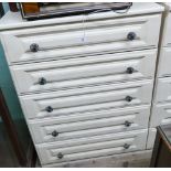 Five drawer light wood chest of drawers with metal handles