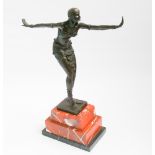 Contemporary bronze after Chiparus of a semi clad dancing girl on a rouge marble base