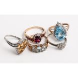 Collection of five 9ct gold ladies dress rings to include large blue topaz and diamond tear drop