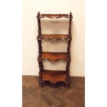 A 4 tier graduated Victorian mahogany shaped front Whatnot