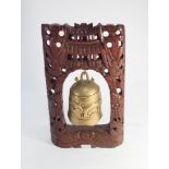 Small Burmese brass temple gong on carved hardwood stand