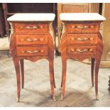 A pair of reproduction French inlaid Kingwood 3 drawer bedside cabinets with cream effect marble