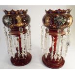 A pair of Bohemian ruby glass gilt and enamelled lustre's 36cms tall Ruby glass